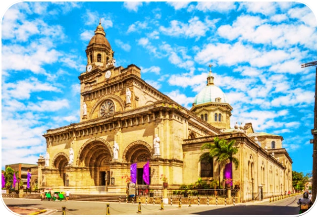 Manila Cathedral facade under bright blue sky in Intramuros, a historical church in the Philippines